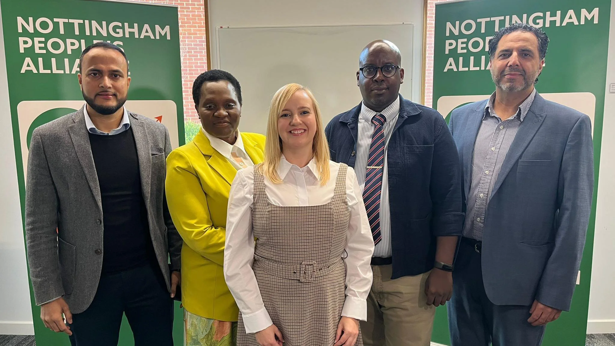 Faith Gakanje-Ajala with civic and community leaders at a Nottingham People's Alliance gathering.