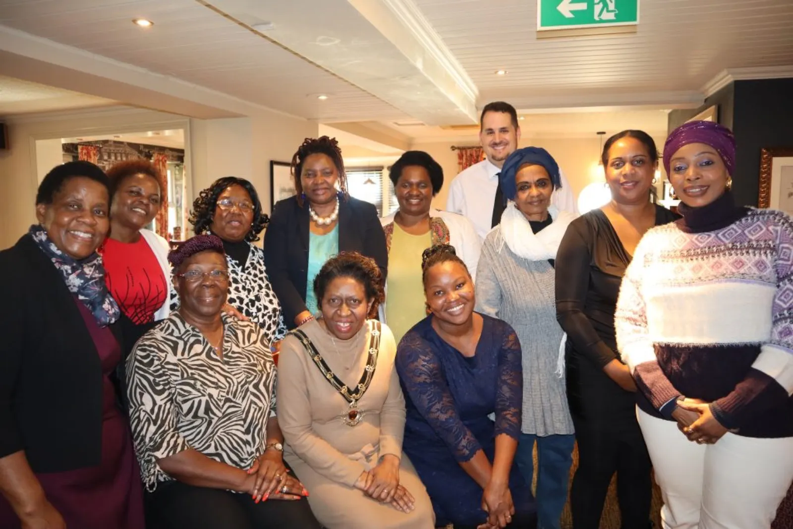 A group of women gathered together at a community meal.