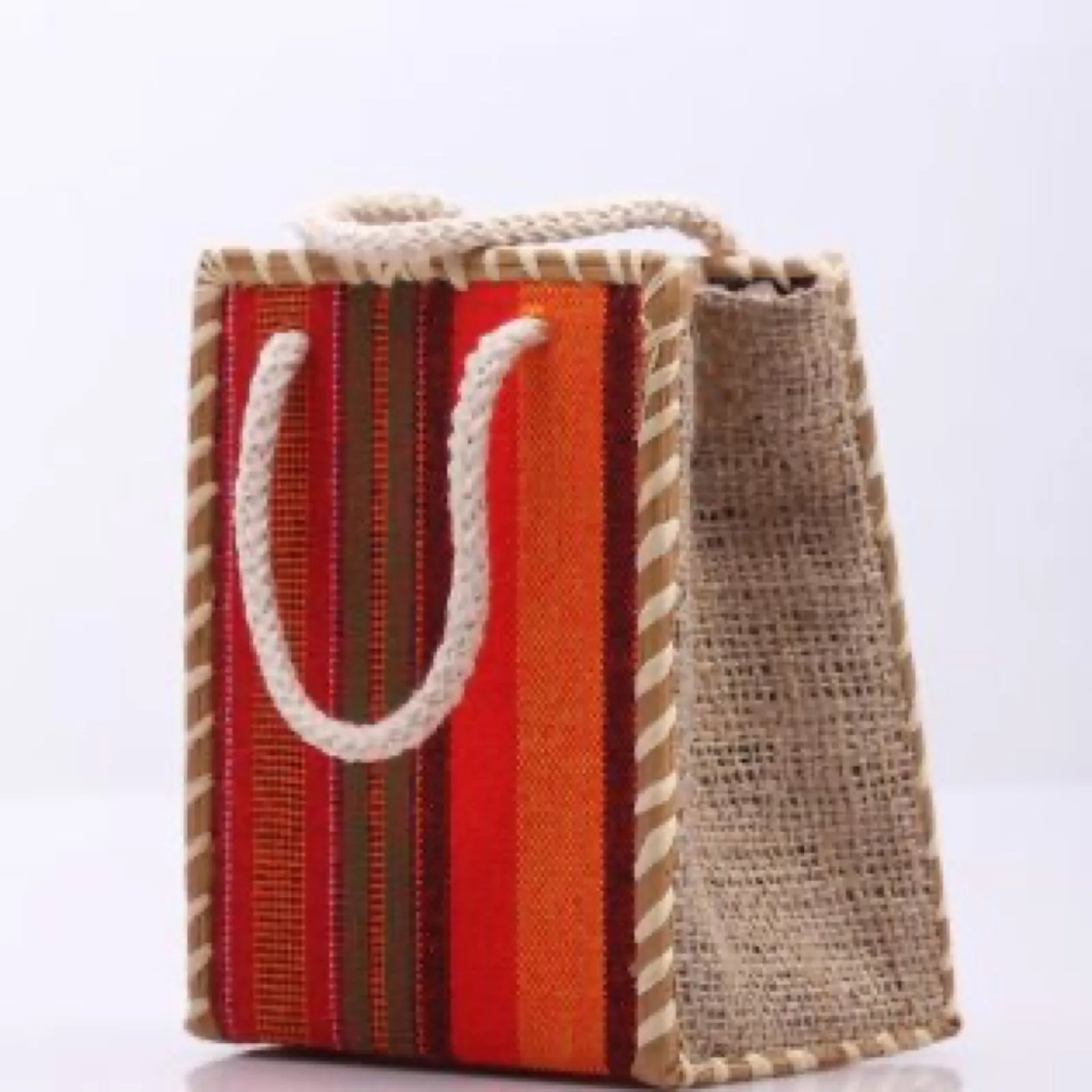 A handmade woven bag with red and orange stripes.