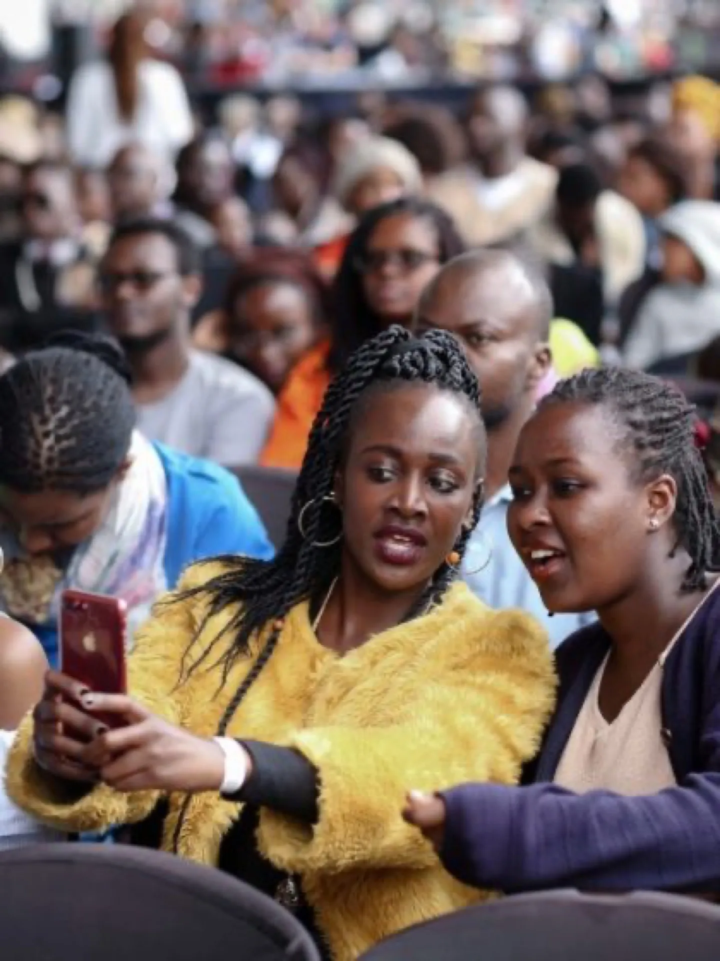 A crowd of people at a busy community event.