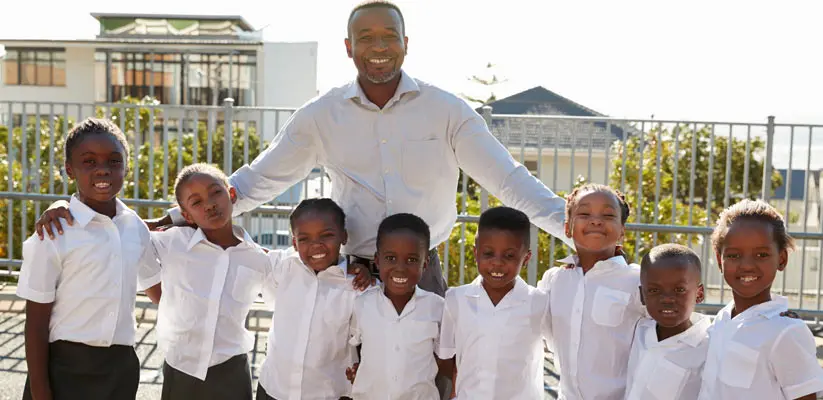 teacher-and-elementary-school-kids-in-playground-p-PNFBGPS._1